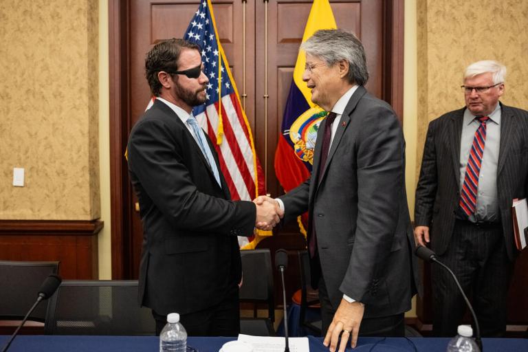 Rep. Dan Crenshaw, R-TX, (left) shakes hands with Ecuadorian President Guillermo Lasso, at a private briefing on Capitol Hill on Sept. 27, 2023. 