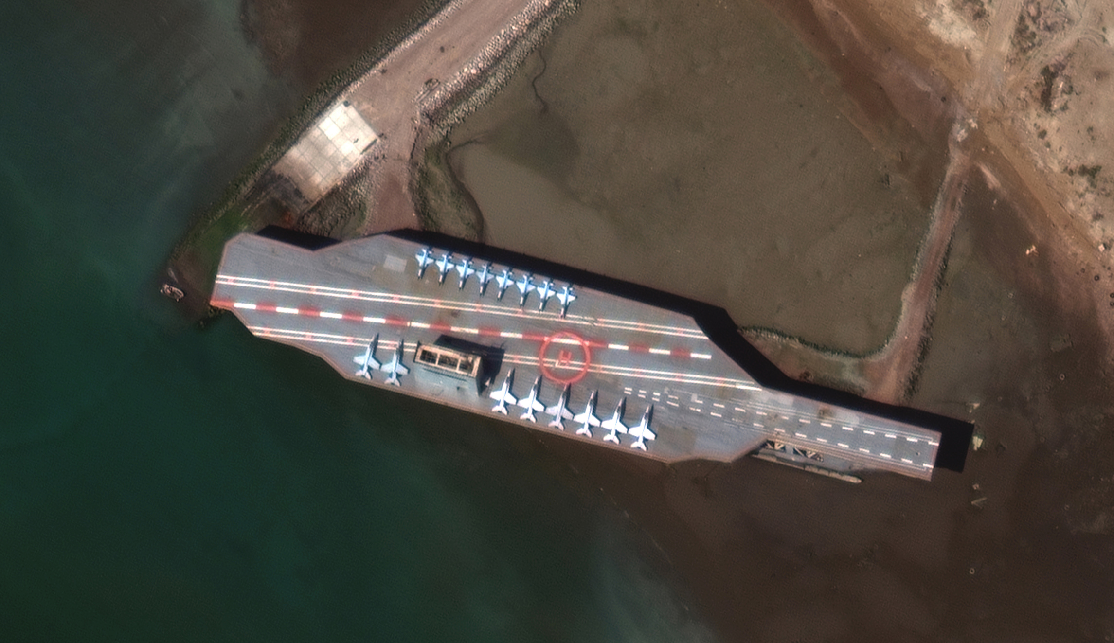 Iran’s mock US aircraft carrier leaves port and heads to sea, satellite images show