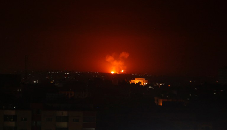 An explosion by Israeli airstrikes is seen in Gaza City early Monday, Feb. 24, 2020. Israel's military says it struck Palestinian militants in Gaza and Syria after they fired some 20 rockets toward southern Israel. The rockets on Sunday evening came hours after Israel said it killed a Palestinian militant who tried to place a bomb along the Israel-Gaza barrier fence.