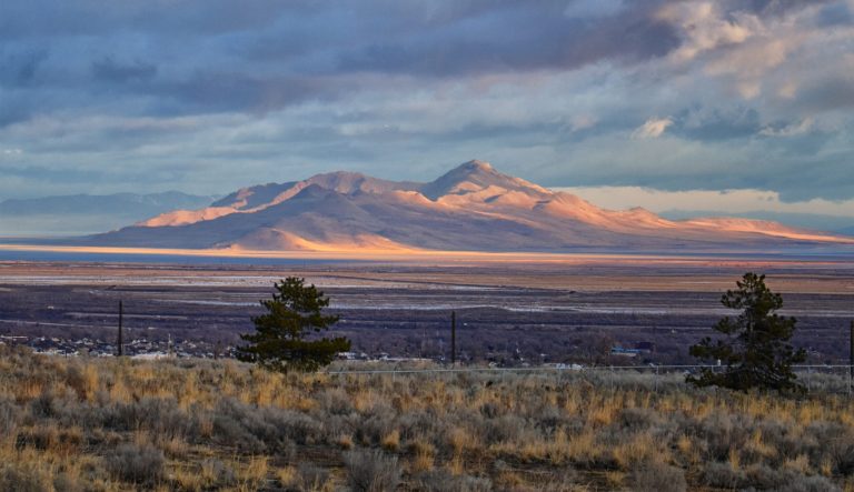 Antelope Island view from Magna, Utah at sunrise with the Great Salt Lake State Park in winter.