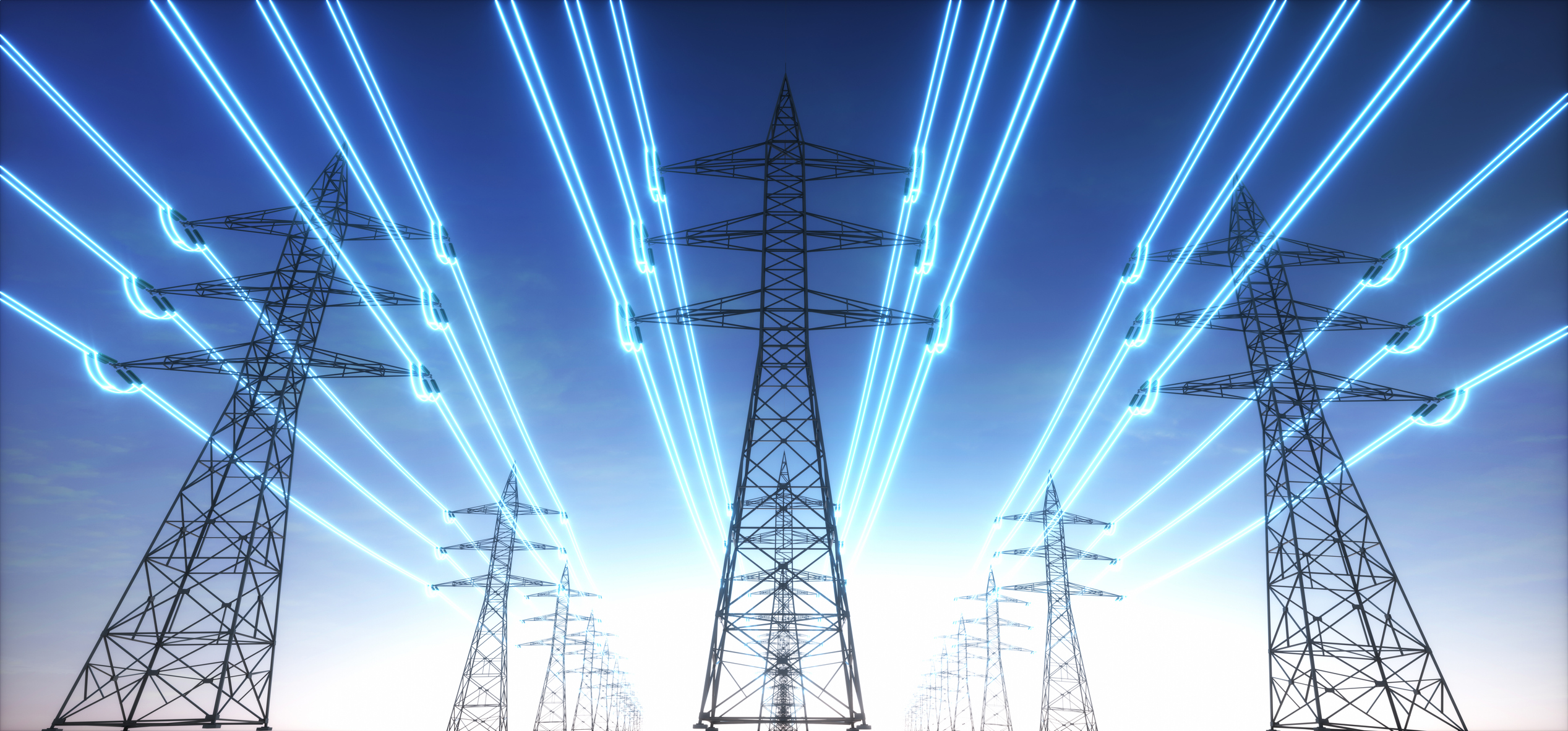 Electricity transmission towers with glowing wires