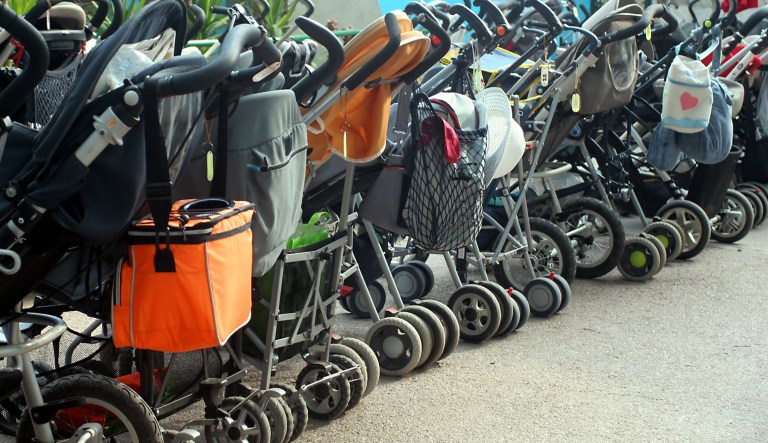 A row of strollers is seen.