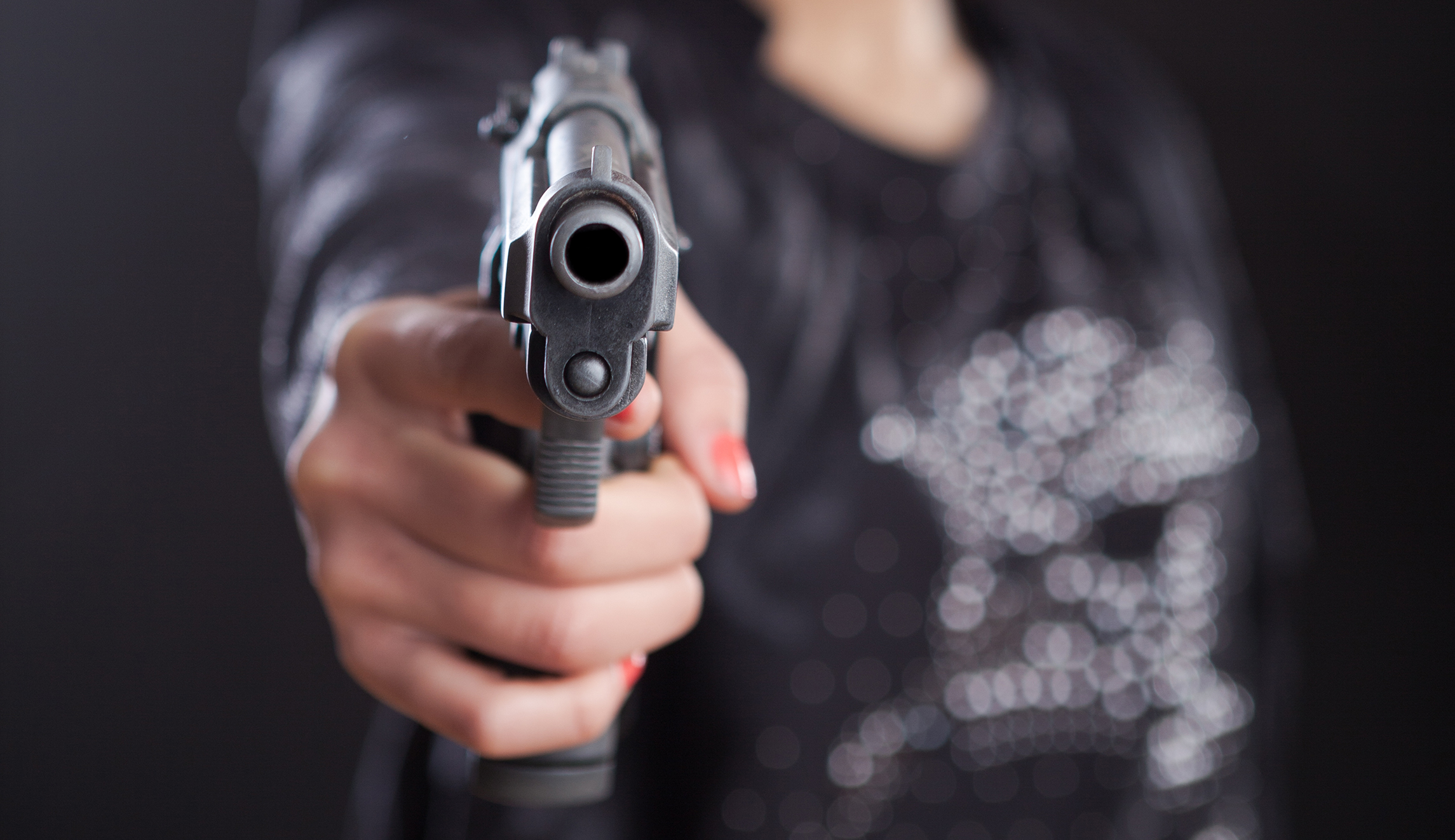 College suspends student for posing with gun at gun range