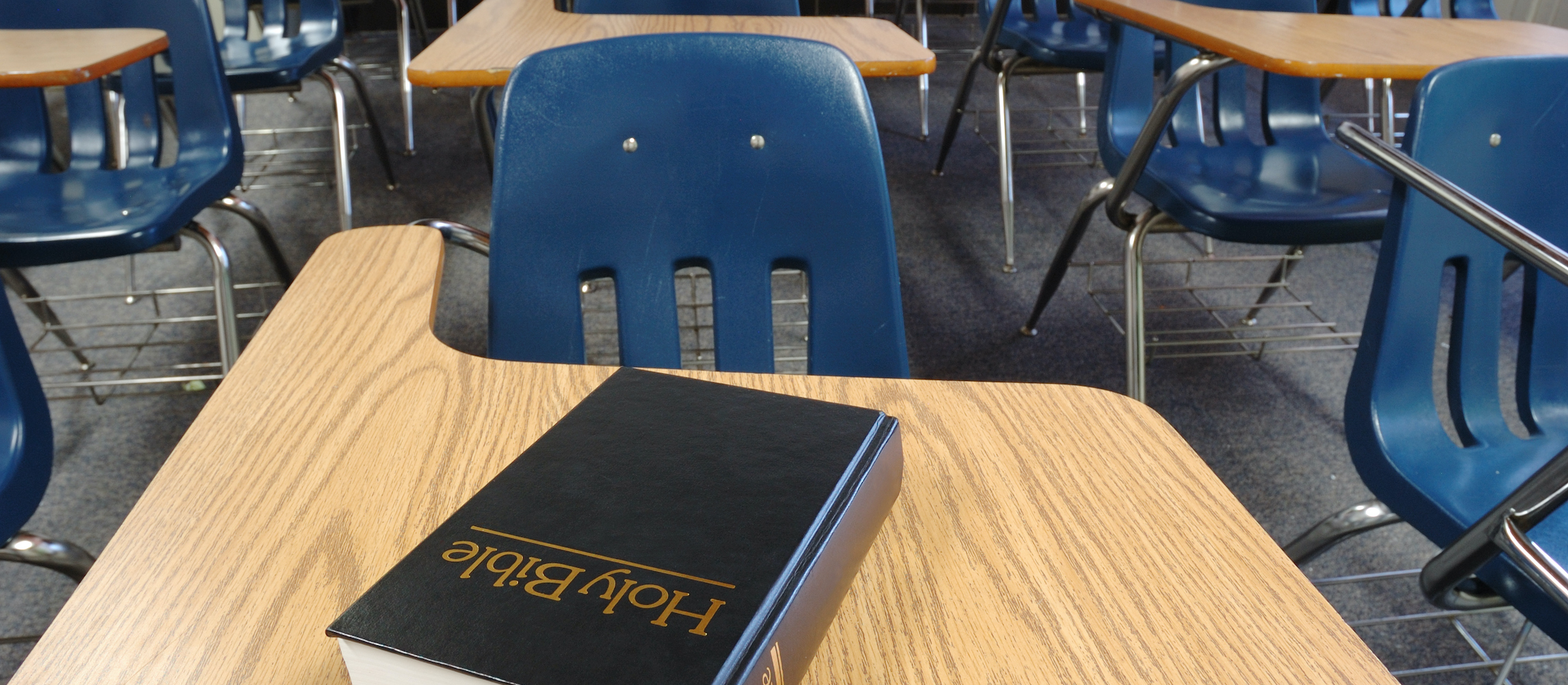 Holy Bible Lying on a Parochial School Desk