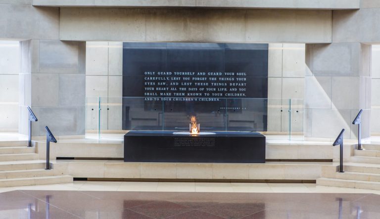 Washington, D.C. -  March 19, 2015: Eternal flame on top of block holding dirt from concentration camps in Europe in the Hall of Remembrance inside US Holocaust Memorial Museum.