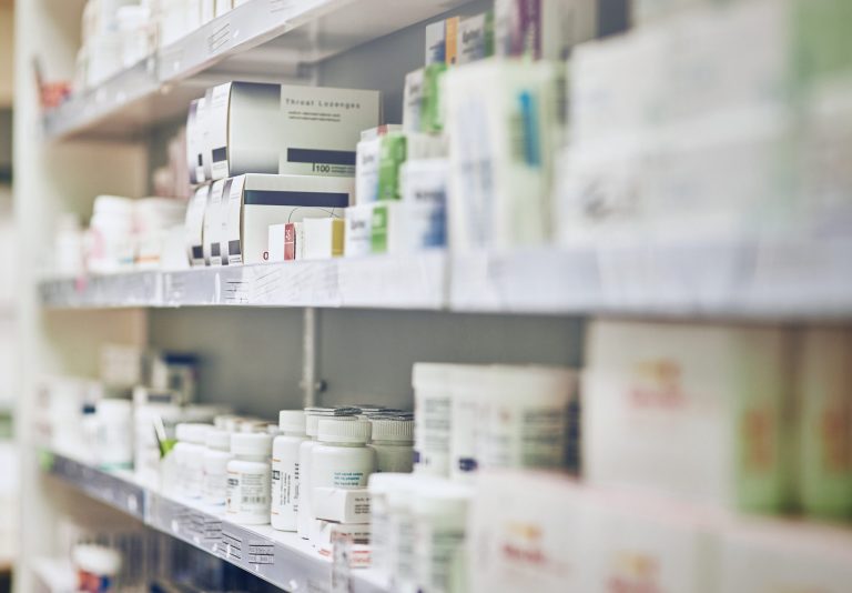 Cropped shot of shelves in a pharmacyHigh drug prices