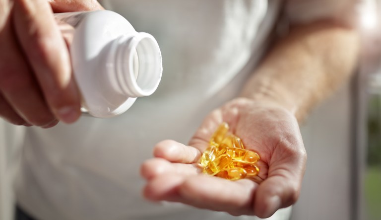 Bottle of omega 3 fish oil capsules.
