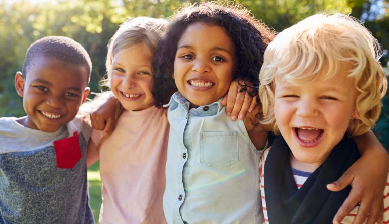 Four young children playing together.