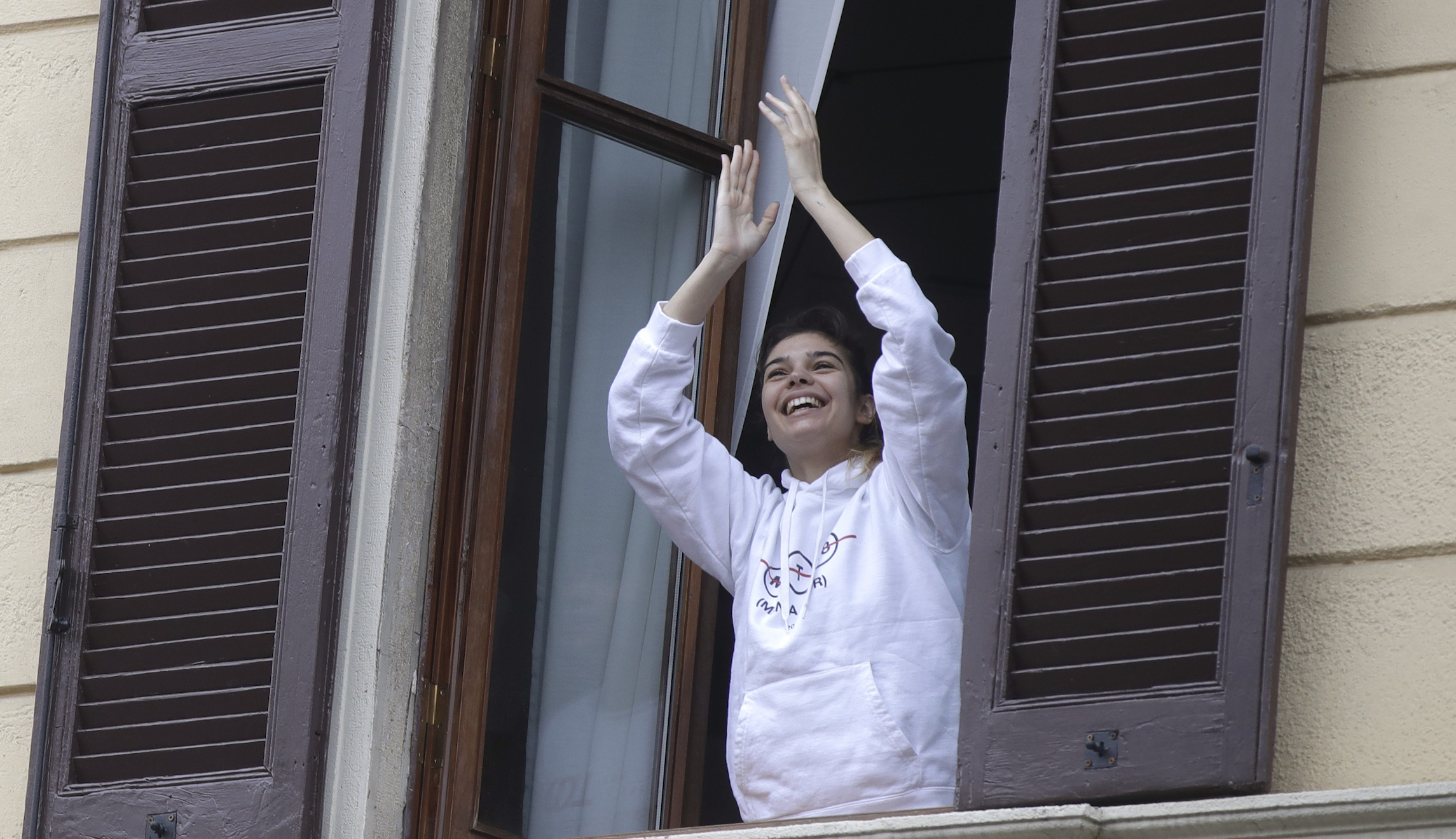 Italians sing songs from their balconies to boost morale during national shutdown