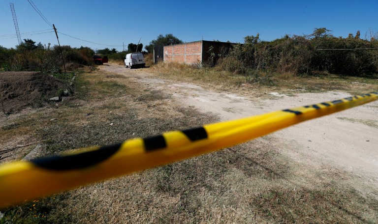 A security tape, prevents the passage to the area where searched bodies in El Salto, outside metropolitan area of Guadalajara, state of Jalisco, Monday, Nov. 23, 2020. Mexican authorities have recovered 113 bodies and additional human remains from a secret grave outside the western city of Guadalajara.  (AP Photo/Refugio Ruiz)                                                                                                                                                                    
