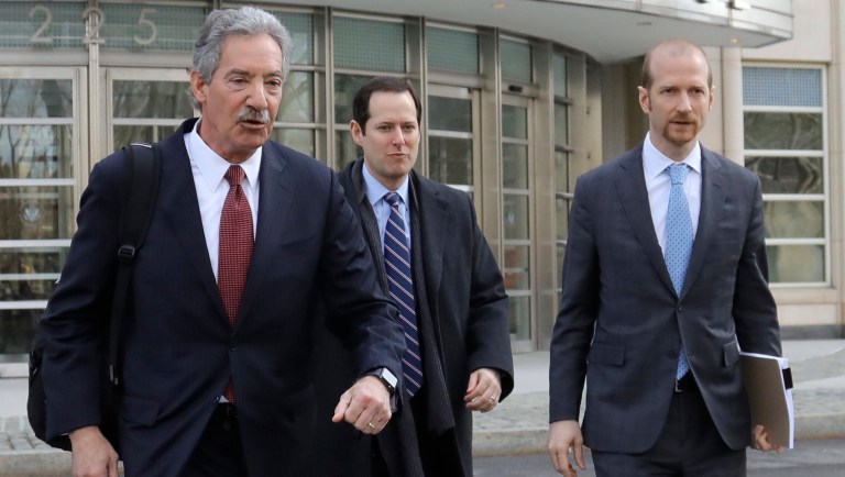 Lawyers for the Chinese electronics giant Huawei from left, James Cole, Michael Alexander Levy, and David Bitkower leave Brooklyn federal court in New York, Thursday, March 14, 2019.