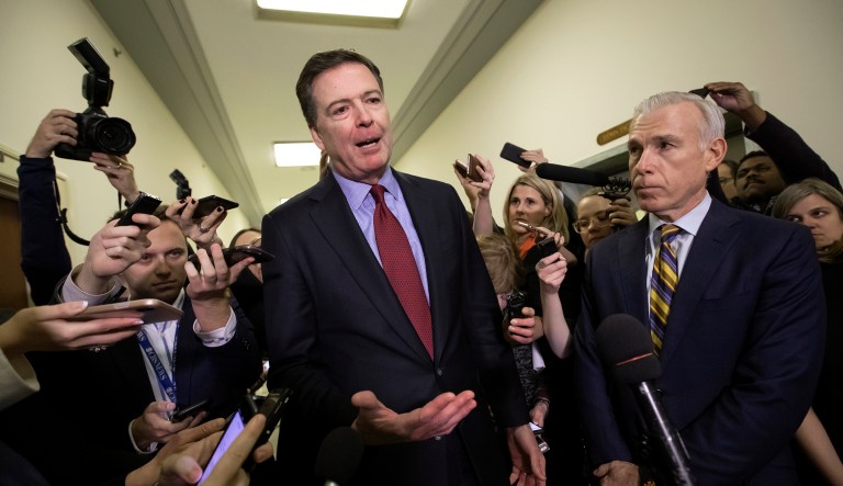 Former FBI Director James Comey, with his attorney, David Kelley, right, speaks to reporters after a day of testimony before the House Judiciary and Oversight committees, on Capitol Hill in Washington, Friday, Dec. 7, 2018.
