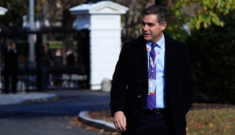 CNN's Jim Acosta walks on the North Lawn driveway upon returning back to the White House in Washington, Friday, Nov. 16, 2018.