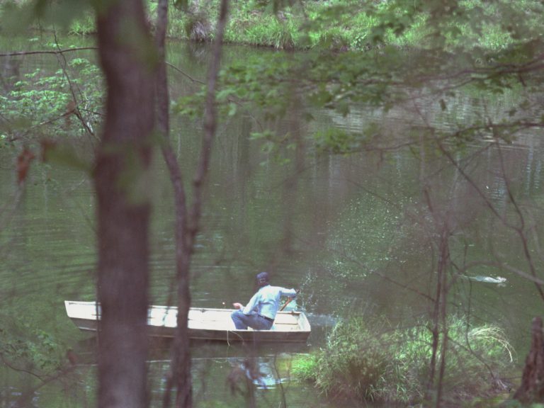 President Jimmy Carter in a boat in Plains, Ga., after warding off a rabbit.