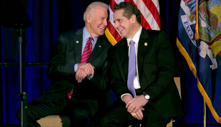 Vice President Joe Biden talks with New York Gov. Andrew Cuomo during a rally on the economy,  Friday, Jan. 29, 2016, in New York.