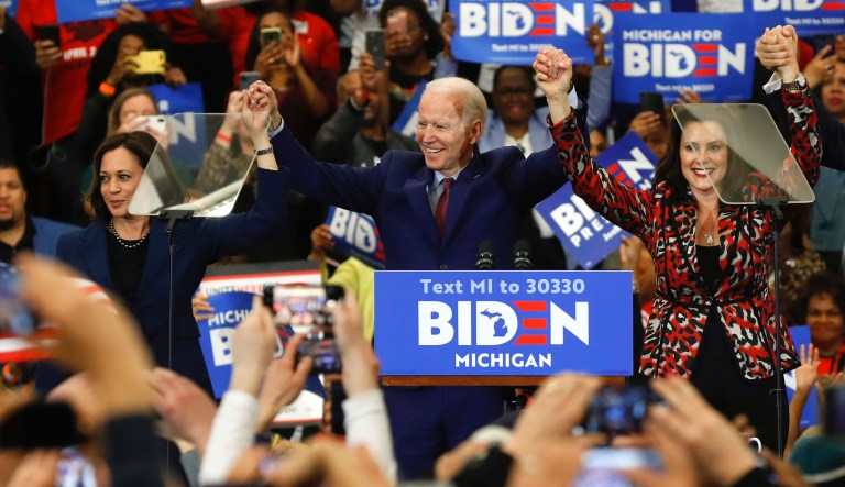 Sen. Kamala Harris, D-Calif., from left,  Democratic presidential candidate former Vice President Joe Biden, Michigan Gov. Gretchen Whitmer, and Sen. Cory Booker D-N.J. greet the crowd during a 2020 campaign rally.