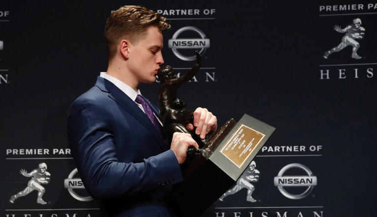 NCAA college football player, LSU quarterback Joe Burrow poses for a photo after winning the Heisman Trophy on Saturday, Dec. 14, 2019 in New York. 