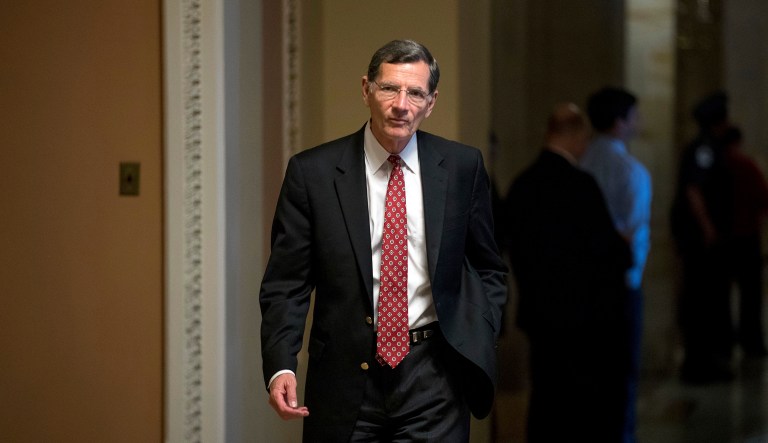 Sen. John Barrasso, R-Wyo., walks to the Senate Chamber at the U.S. Capitol.