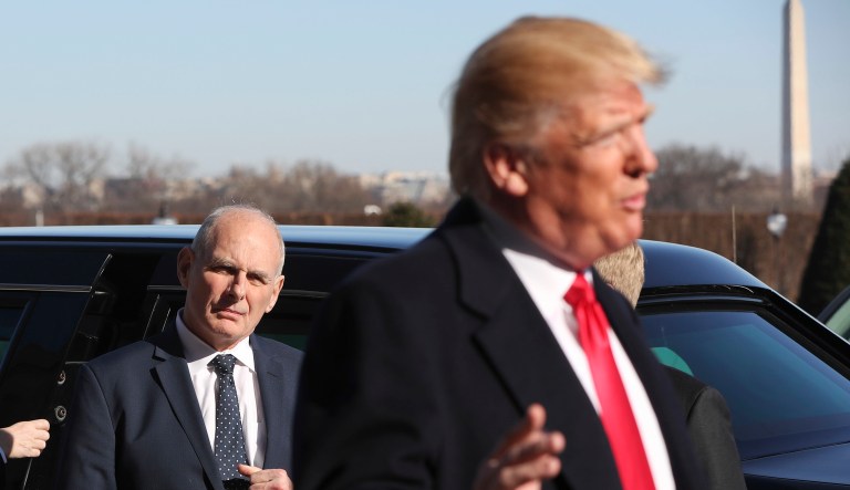 White House Chief of Staff John Kelly, left, watches as President Donald Trump makes remarks to members of the media during his arrival at the Pentagon, Thursday, Jan. 18, 2018.