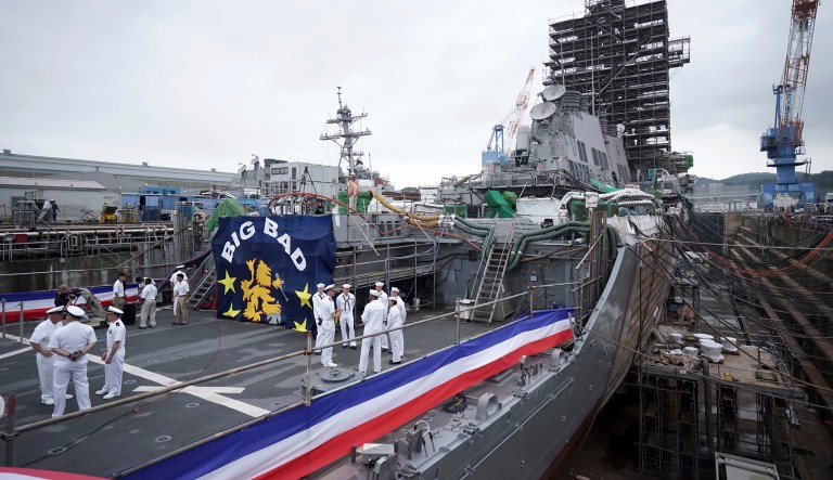 The USS John S. McCain under repair at a dry dock is seen after a rededication ceremony for at the U.S. Naval base in Yokosuka, southwest of Tokyo, Thursday, July 12, 2018.