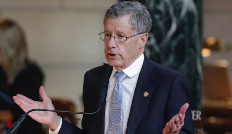 Neb. state Sen. John McCollister of Omaha gestures during debate Tuesday, April 11, 2017, in Lincoln, Neb., on a proposal that would require online retailers to collect sales taxes if their gross revenue in Nebraska exceeds $100,000 or they conduct 200 or more transactions in the state.