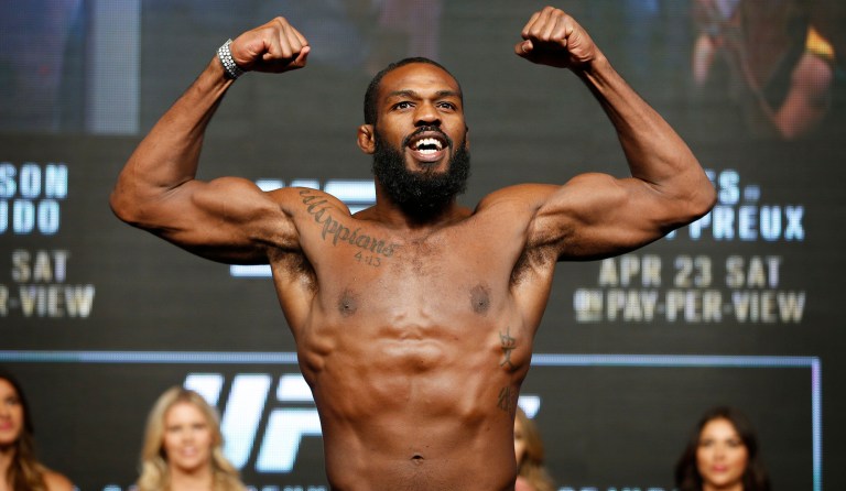 Jon Jones reacts on the scale during a weigh-in for UFC 197, Friday, April 22, 2016, in Las Vegas. Jones is scheduled to fight Ovince Saint Preux in an interim light heavyweight title bout Saturday in Las Vegas.