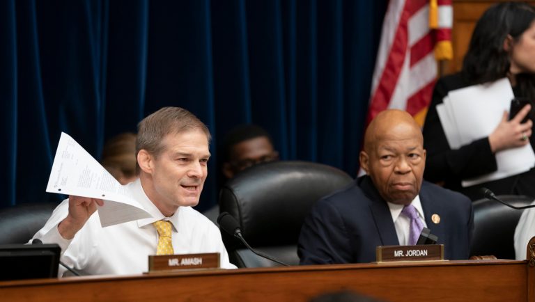 Rep. Jim Jordan, left, the House Oversight and Reform Committee's ranking Republican, delivers an opening statement in opposition to Chairman Elijah Cummings, D-Md., right, as Cummings calls for subpoenas after a career official in the White House security office says dozens of people in President Donald Trump's administration were granted security clearances despite "disqualifying issues" in their backgrounds, on Capitol Hill in Washington, Tuesday, April 2, 2019. The issue sets the stage for another fight between the White House and the Democratic-controlled House. 