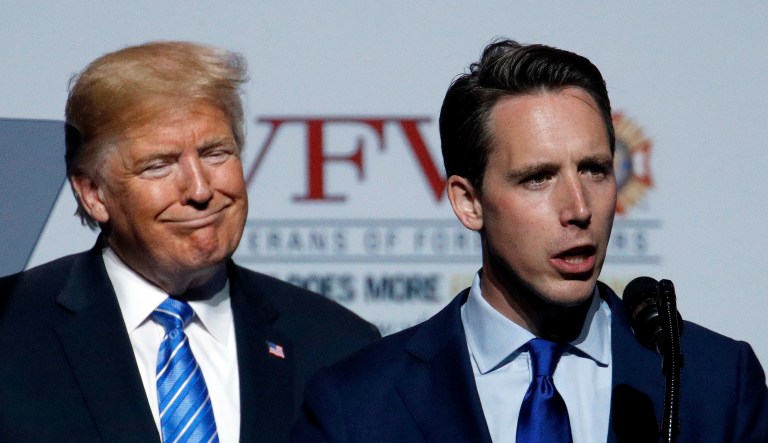 Missouri Attorney General and Republican U.S. Senate candidate Josh Hawley talks while President Donald Trump listens at the Veteran's of Foreign Wars national convention Tuesday, July 24, 2018, in Kansas City, Mo.