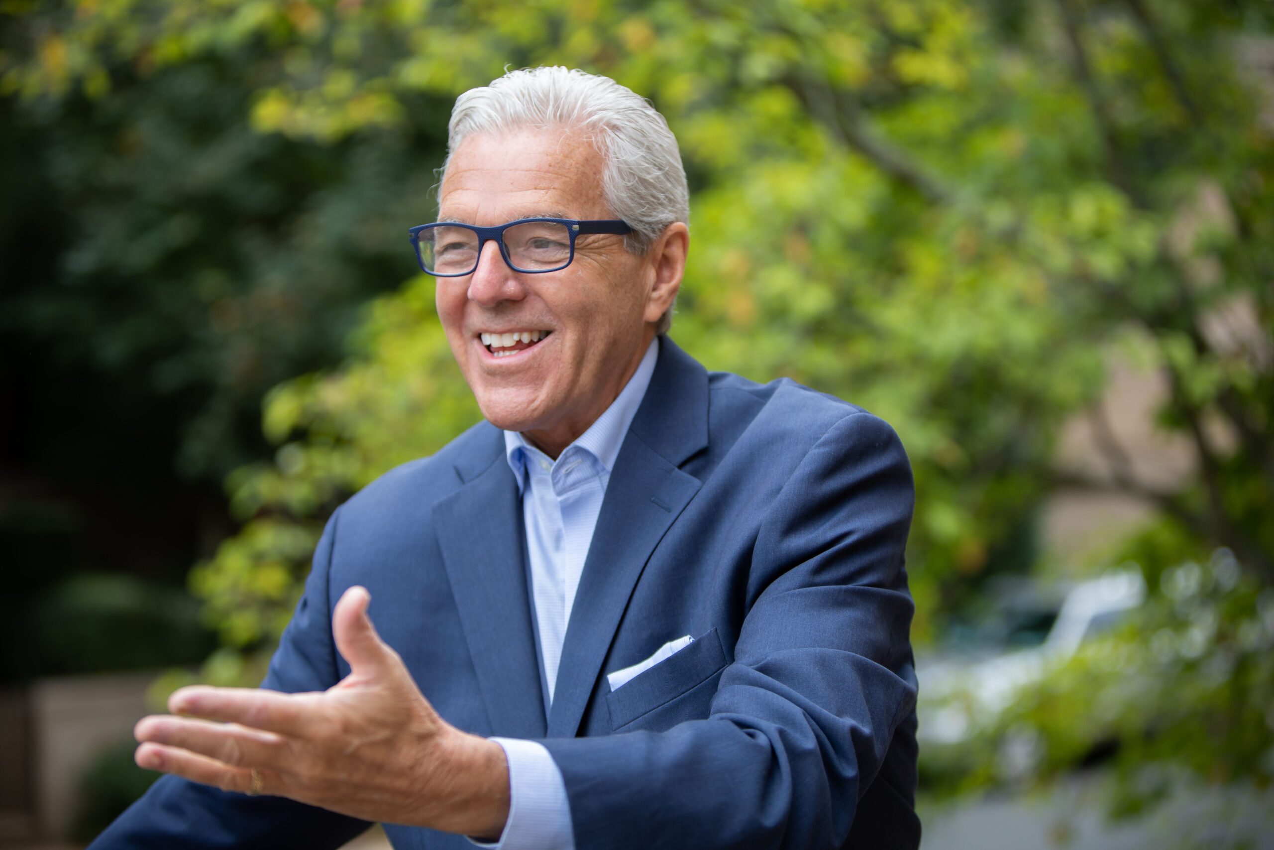 JSR OCT Glasses with smile and hand gesture.jpeg