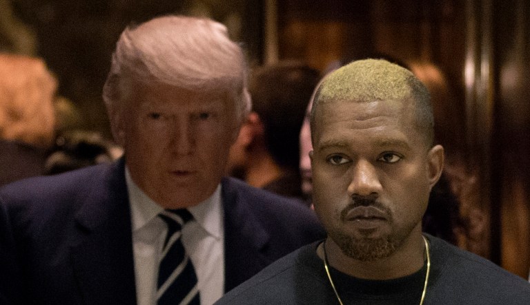 Kanye West and President-elect Donald Trump arrive to the lobby of Trump Tower in New York, Tuesday, Dec. 13, 2016.