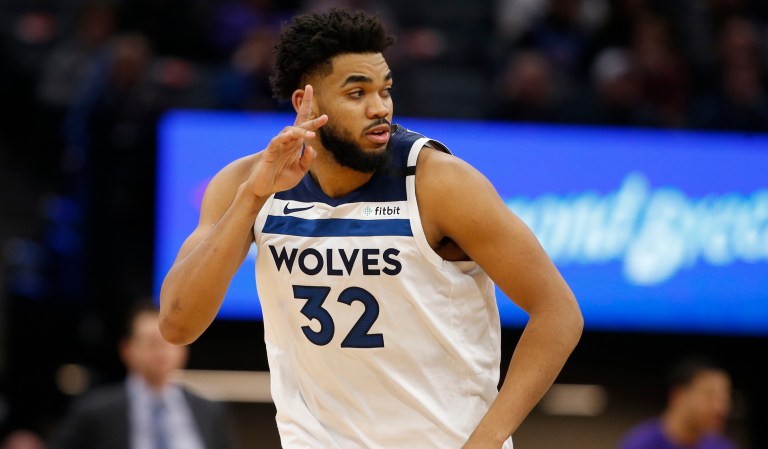Minnesota Timberwolves center Karl-Anthony Towns flashes three fingers after scoring a 3-pointer during the second half of an NBA basketball game against the Sacramento Kings in Sacramento, Calif., Monday, Feb. 3, 2020. The Kings won 113-109. (AP Photo/Rich Pedroncelli)