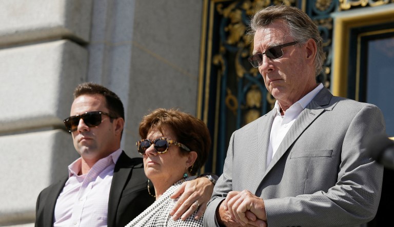 In this Sept. 1, 2015 file photo, from left, Brad Steinle, Liz Sullivan and Jim Steinle, the brother, mother and father of Kate Steinle who was shot to death on a pier, listen to their attorneys speak during a news conference on the steps of City Hall in San Francisco. 
