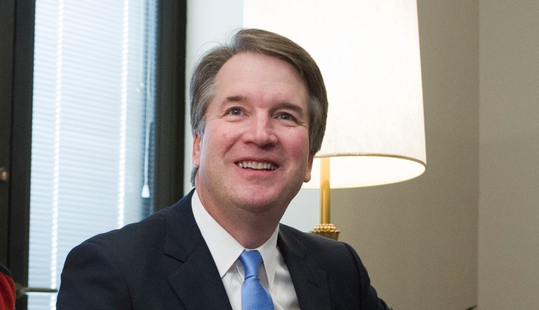 Supreme Court nominee Brett Kavanaugh sits on a couch before meeting with Sen. Dan Sullivan, R-Alaska, Thursday, July 12, 2018, on Capitol Hill in Washington.