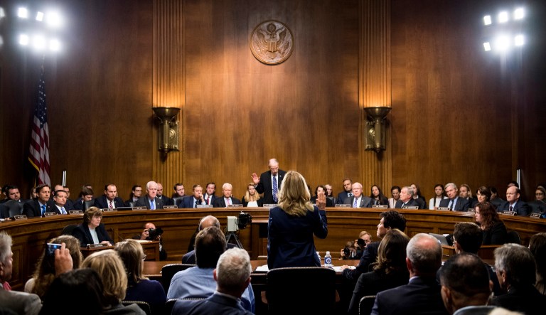 Christine Blasey Ford is sworn in by Senate Judiciary Committee chairman Chuck Grassley, R-Iowa, to testify before the Senate Judiciary Committee on Capitol Hill in Washington, Thursday, Sept. 27, 2018.