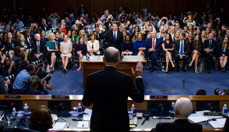 President Donald Trump's Supreme Court nominee, Brett Kavanaugh is sworn-in by Senate Judiciary Committee Chairman Chuck Grassley, R-Iowa, as he appears before the Senate Judiciary Committee on Capitol Hill in Washington, Tuesday, Sept. 4, 2018, to begin his confirmation to replace retired Justice Anthony Kennedy.