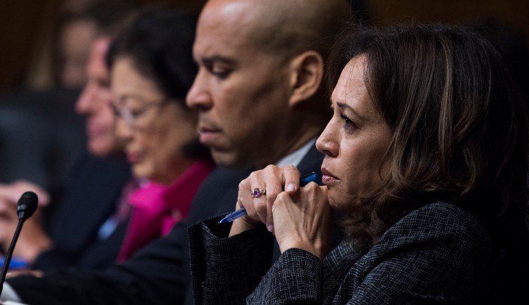 UNITED STATES - SEPTEMBER 27: Sen. Cory Booker, D-N.J., and Sen. Kamala Harris, D-Calif., listen as Dr. Christine Blasey Ford testifies during the Senate Judiciary Committee hearing on the nomination of Brett M. Kavanaugh to be an associate justice of the Supreme Court of the United States, focusing on allegations of sexual assault by Kavanaugh against Christine Blasey Ford in the early 1980s.