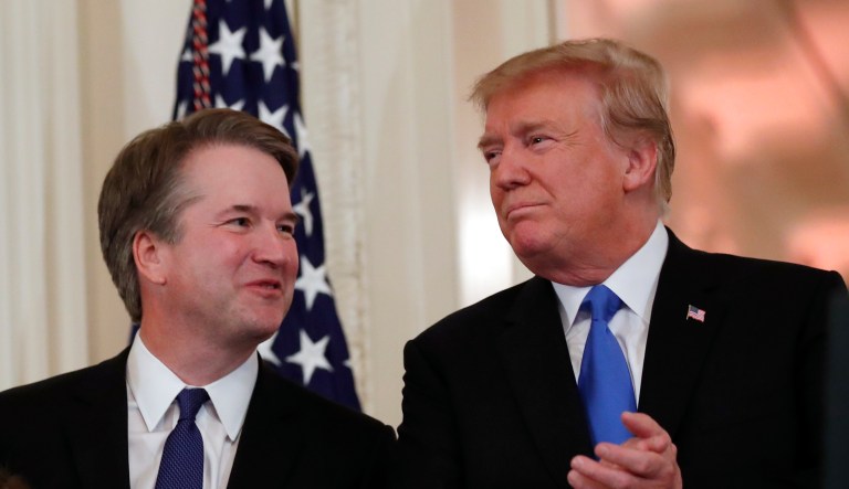 President Donald Trump stands with Judge Brett Kavanaugh his Supreme Court nominee, and his family in the East Room of the White House, Monday, July 9, 2018, in Washington. 