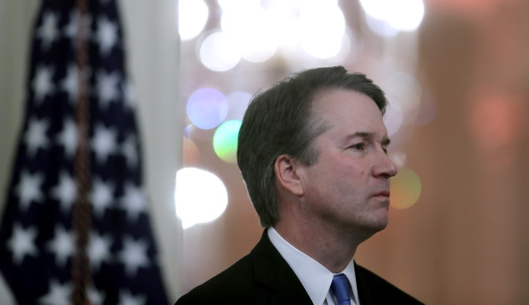 Brett Kavanaugh, associate justice of the U.S. Supreme Court, listens as U.S. President Donald Trump, not pictured, speaks during a ceremonial swearing-in event in the East Room of the White House in Washington, D.C., U.S., on Monday, Oct. 8, 2018. 