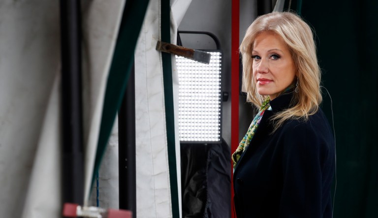 White House senior adviser Kellyanne Conway looks to her left as she is interviewed by a television crew outside the White House, Friday, Jan. 18, 2019, in Washington.