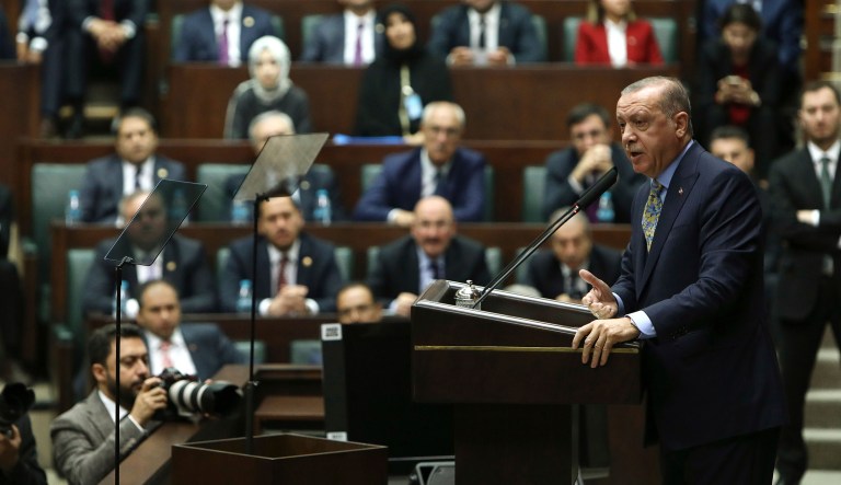 Turkey's President Recep Tayyip Erdogan addresses members of his ruling Justice and Development Party (AKP), at the parliament in Ankara, Turkey, Tuesday, Oct. 23, 2018. 
