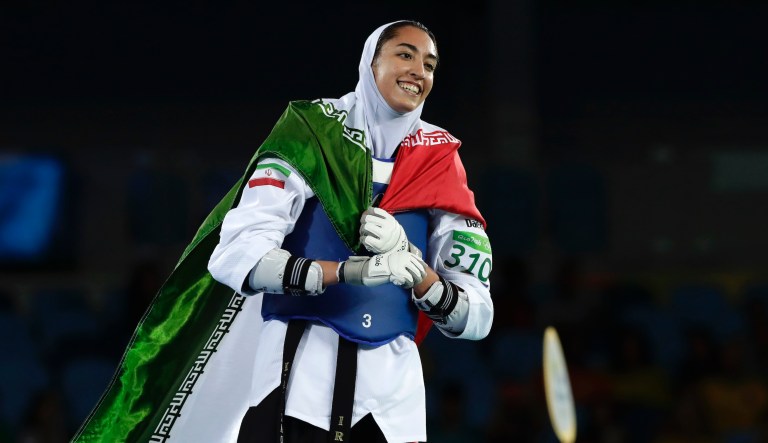 Kimia Alizadeh Zenoorin, of Iran, celebrates after winning a bronze medal in women's 57-kg taekwondo competition at the 2016 Summer Olympics in Rio de Janeiro, Brazil, Thursday, Aug. 18, 2016.