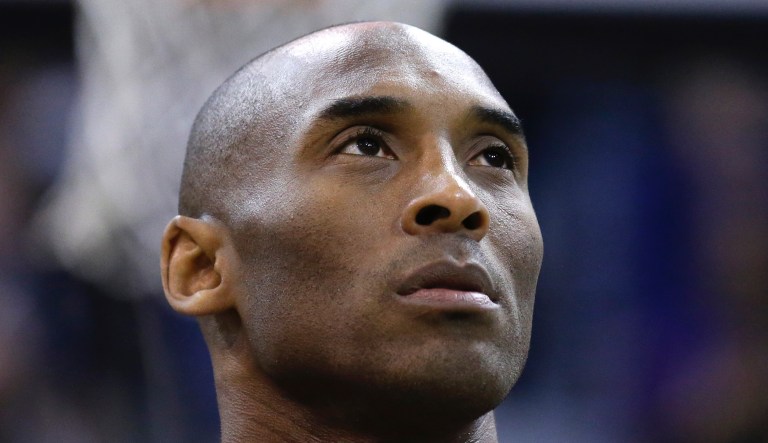 FILE - In this March 28, 2016, file photo, Los Angeles Lakers forward Kobe Bryant looks on before the start of their NBA basketball game against the Utah Jazz, in Salt Lake City. Bryant, the 18-time NBA All-Star who won five championships and became one of the greatest basketball players of his generation during a 20-year career with the Los Angeles Lakers, died in a helicopter crash Sunday, Jan. 26, 2020.