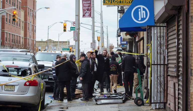 Responders work to clean up the scene of a shooting that left multiple dead at a kosher market on Dec. 11, 2018, in Jersey City, NJ. Police killed two gunmen who had earlier killed an officer at a cemetery in Jersey City.   