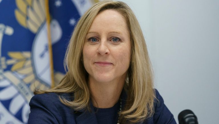 New Bureau of Consumer Financial Protection director Kathy Kraninger pauses as she speaks to media at the Bureau of Consumer Financial Protection offices in Washington, Tuesday, Dec. 11, 2018. 