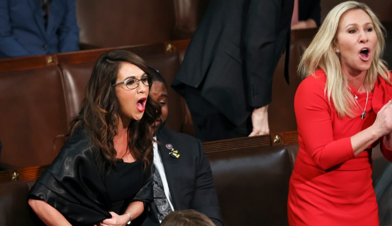 Rep. Lauren Boebert (R-CO) and Rep. Marjorie Taylor Greene (R-GA) scream "Build the Wall" at President Joe Biden during Biden's State of the Union address to a joint session of the U.S. Congress in the House of Representatives Chamber at the Capitol in Washington, March 1, 2022.  