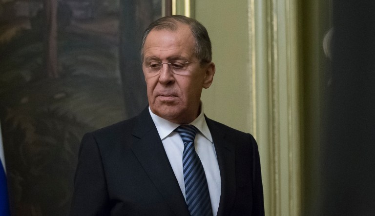 Russian Foreign Minister Sergey Lavrov prepares to speak to the media in Moscow, Russia, Thursday, March 29, 2018. Russia's foreign minister says Moscow will expel the same number of diplomats from the nations that have expelled Russian diplomats over the poisoning of an ex-Russian spy in Britain.