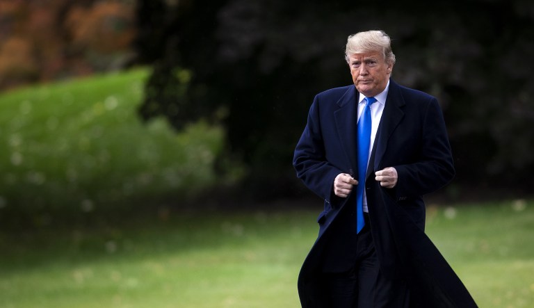 U.S. President Donald Trump walks on the South Lawn of the White House before boarding Marine One in Washington, D.C., U.S., on Friday, Oct. 26, 2018. TrumpÂ vowed to end political violence in the U.S. after the arrest of a suspect in a string of bombing attempts aimed at the president's critics, then used the moment to complain about hostility directed at him.