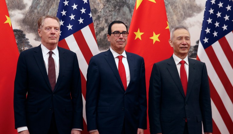 Chinese Vice Premier Liu He, right, poses with U.S. Treasury Secretary Steven Mnuchin, center, and U.S. Trade Representative Robert Lighthizer, left, before they proceed to their meeting at the Diaoyutai State Guesthouse in Beijing, Wednesday, May 1, 2019.