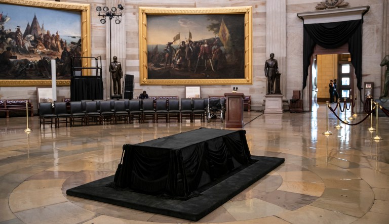 Preparations are being made in the Rotunda of the U.S. Capitol in Washington, Thursday, Aug. 30, 2018, for Sen. John McCain of Arizona who will lie in state tomorrow. His flag-draped casket will lie atop the Lincoln Catafalque, a bier built for the funeral of President Abraham Lincoln.