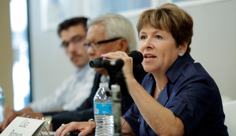 In this photo taken July 17, 2018, Lisa Brown, the presumed Democratic opponent to Republican U.S. Rep. Cathy McMorris Rodgers, speaks during a candidates forum in Colfax, Wash. McMorris Rodgers is sharply attacking Brown in the run-up to August's primary election.